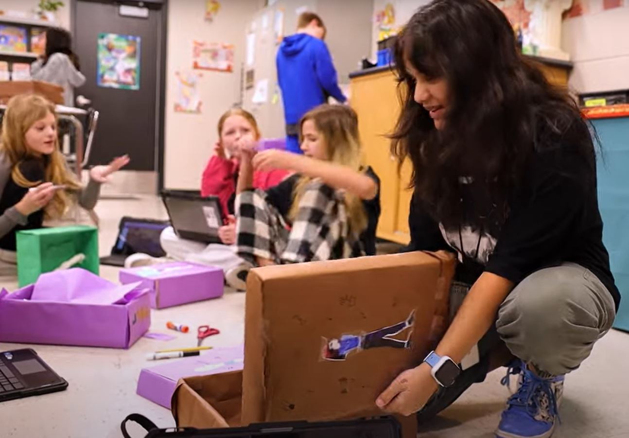  students working on project in class